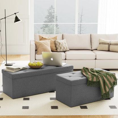 Living room with a beige sectional sofa, gray ottomans, and a laptop on a coffee table.