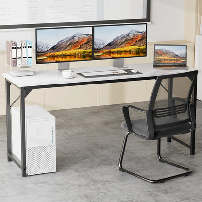 Modern office setup with a L-shaped desk, computer monitors, and chair.
