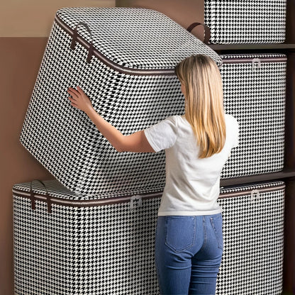 Woman arranging patterned storage boxes against a wall.